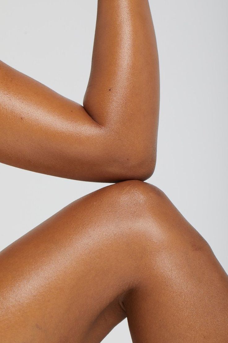 Close-up of an arm and knee, skin lit and soft